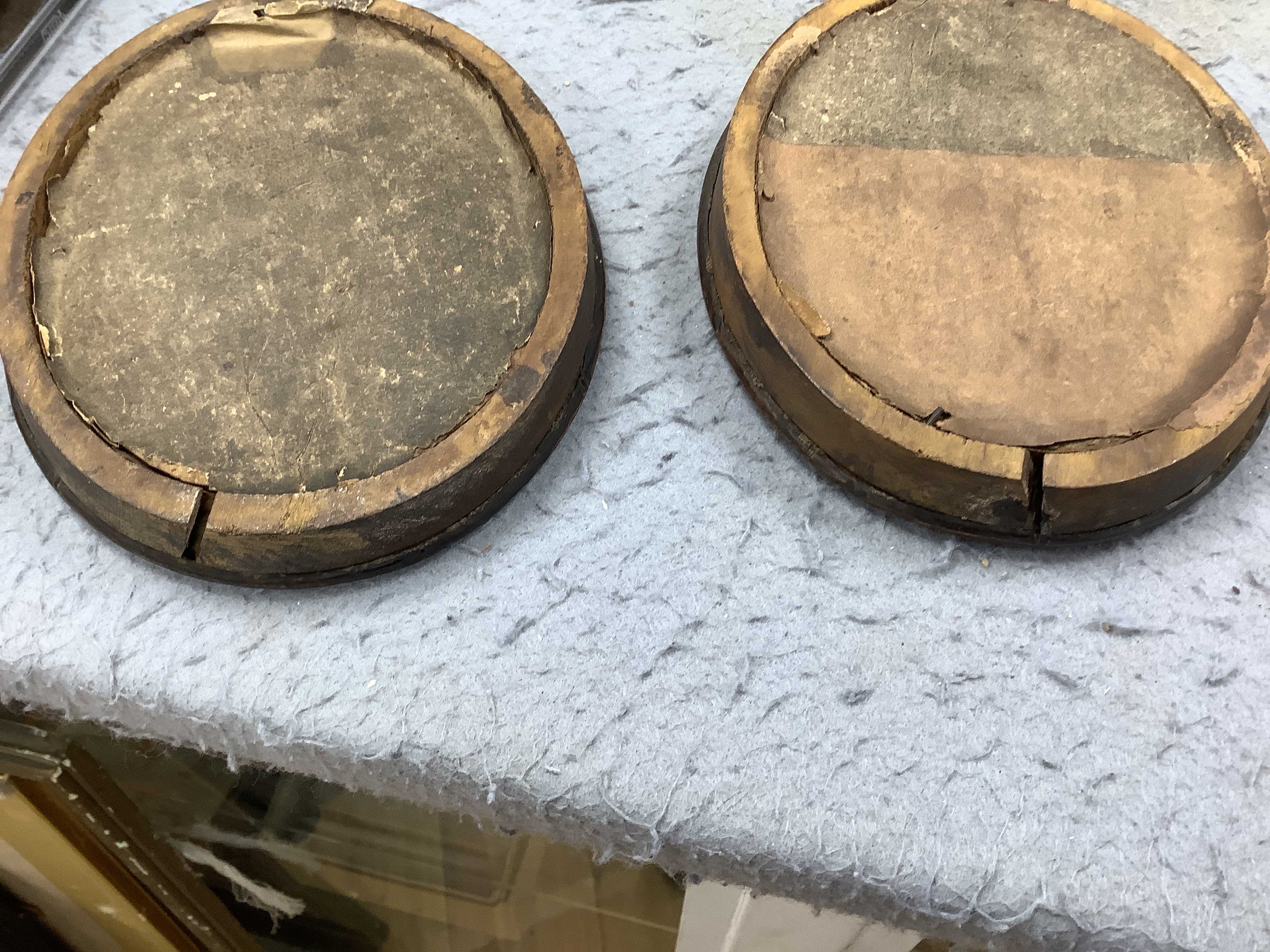 Three late Georgian silhouette portraits, verre eglomise mounts, largest 17cm high